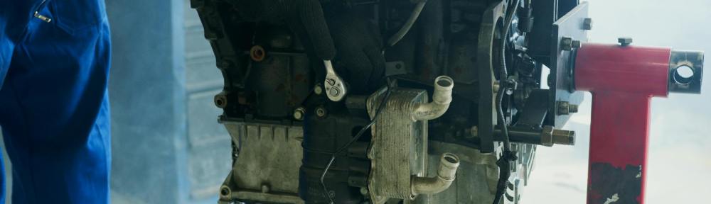 close up of a mechanic fixing an engine
