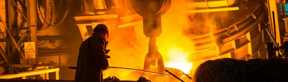 man standing near fire